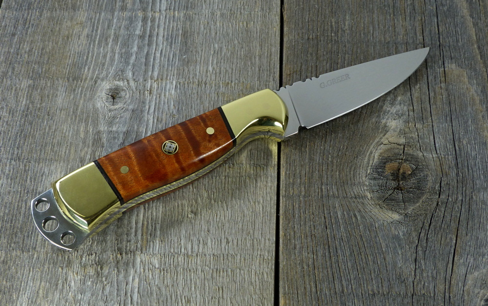High-end everyday carry knife with maple handle and brass bolsters