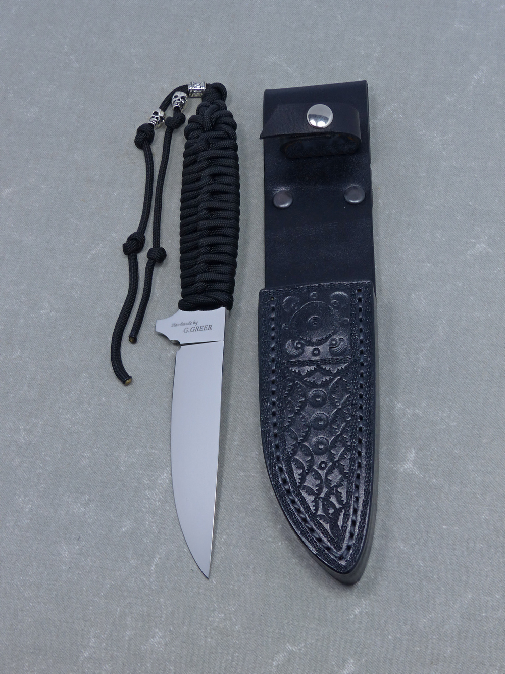 Black paracord tactical knife and sheath