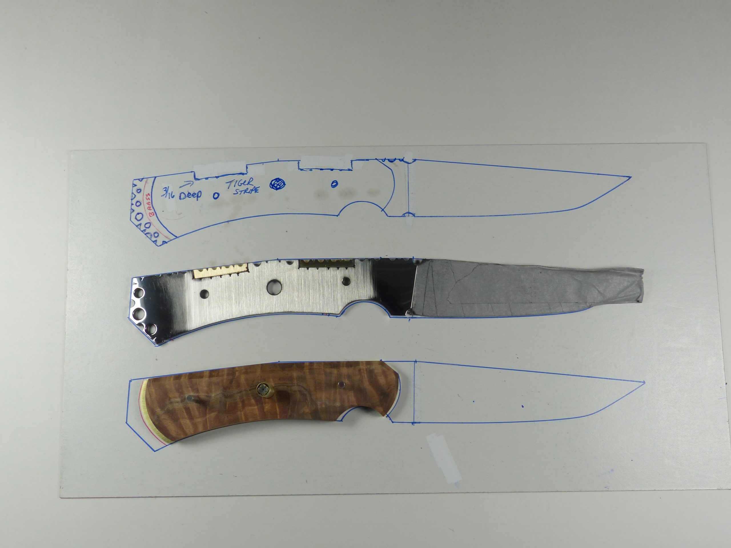 Side view of partially assembled knife and working drawing