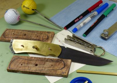 Partially assembled knife on work bench