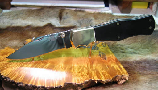 Knife displayed on a fancy piece of wood