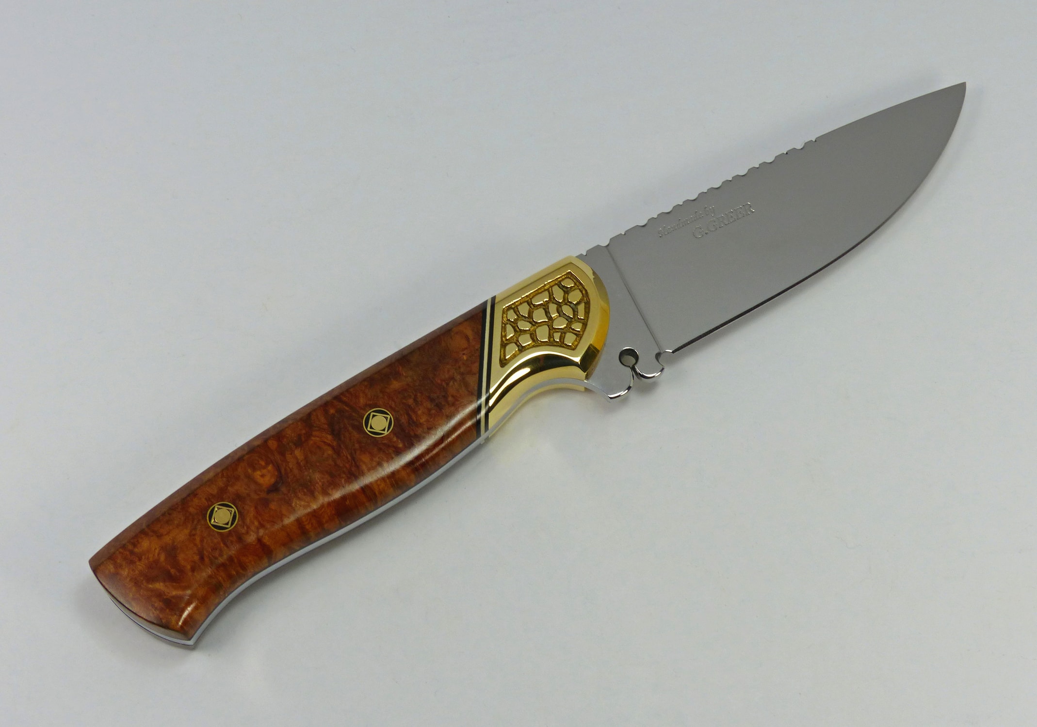 Burled elm art knife with sculptured brass bolsters and pierced ricasso