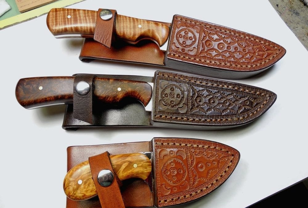 Three completed custom fitted, welted sheaths