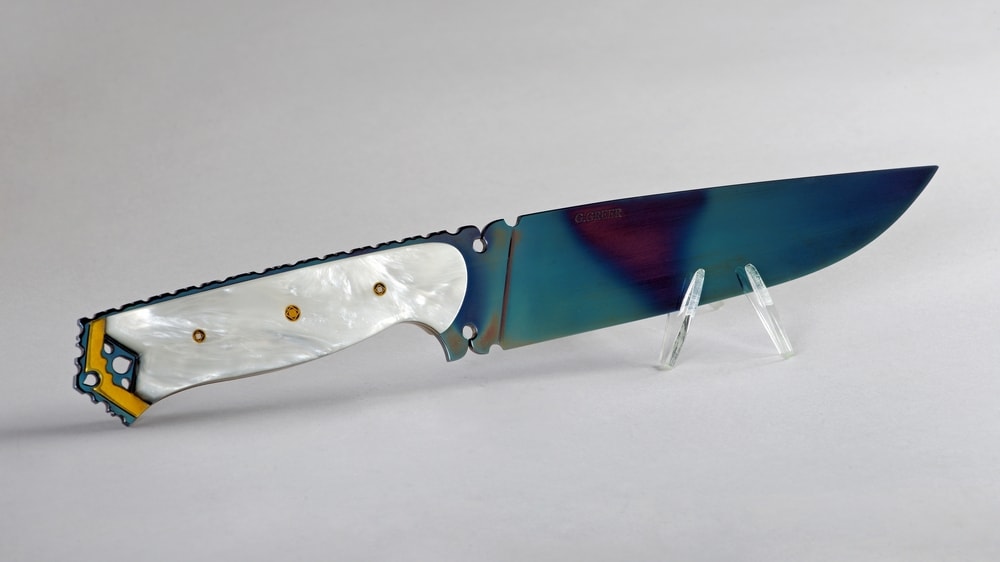 Northern Lights art knife with pearl polymer handle and peacock blue oxidized blade
