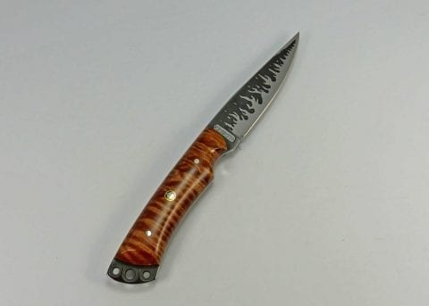Knife with brown tiger striped maple handle and flame etching on blade