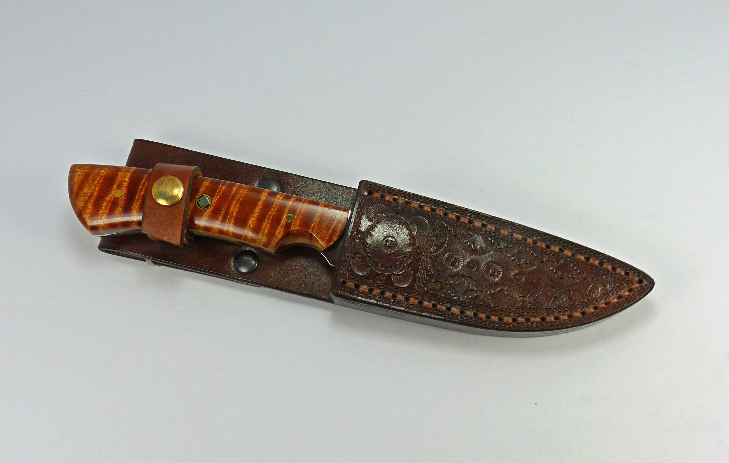 Tiger stripe brown maple wood knife inside handcrafted fitted leather sheath