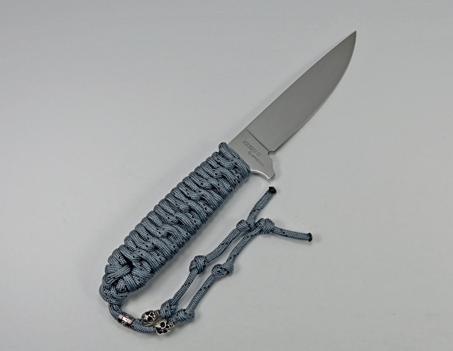 P-2 Titanium colored paracord knife with flat grind blade and lanyard