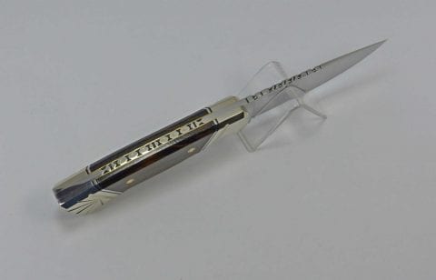 Top view of knife with unique filework and nickel silver embellishments on top and bottom of fixed blade knife