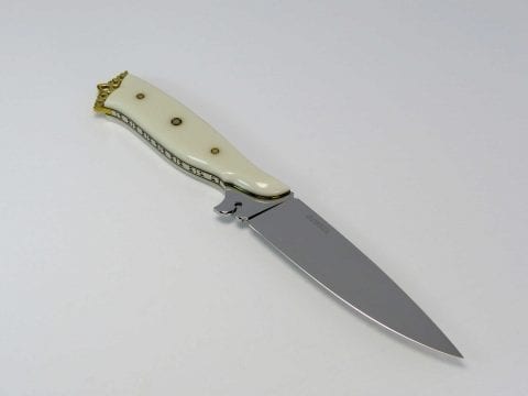 Ivory Corian handle and pierced bottom ricasso on blade