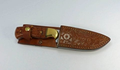Burled elm art knife inside leather sheath handcrafted by Canadian knifemaker