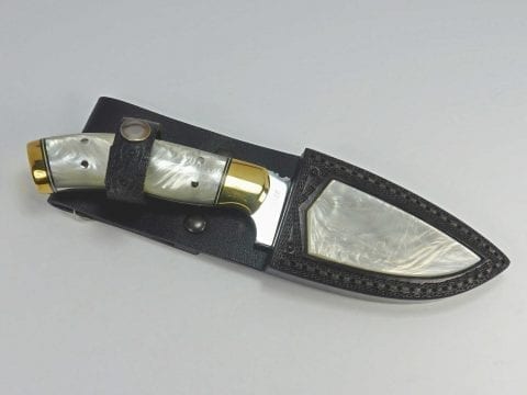 Knife made with white pearlescent material inside matching sheath with pearl polymer inlay