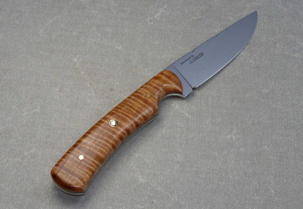 Light brown flame maple hunting knife with mirror polished drop point blade