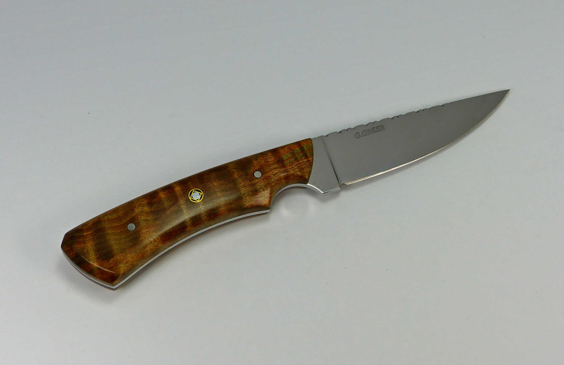 Hunting knife with unique two-tone brown and green color in handle