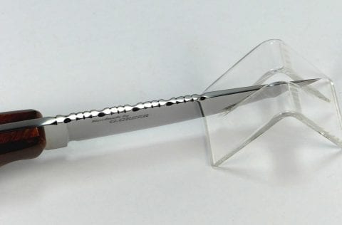 Top blade of knife blade showing filework