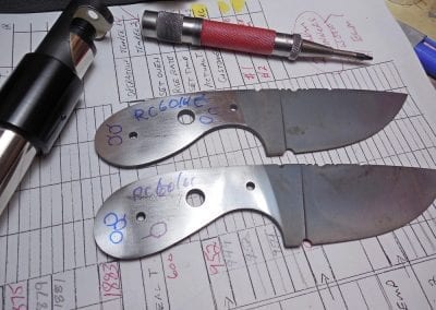 Knife blades being tested for Rockwell hardness