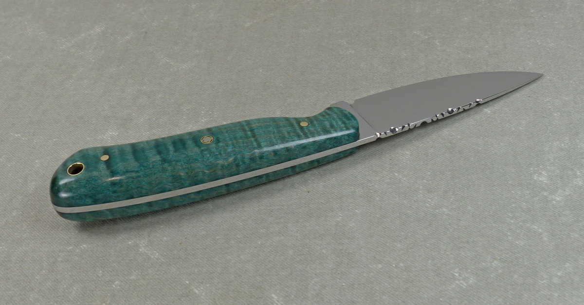 EDC 4 Top view of tang and filework on teal colored everyday carry knife