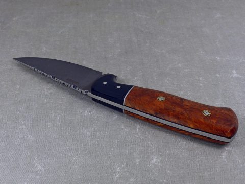 W52 - top view of burled elm hunting knife showing black micarta bolsters