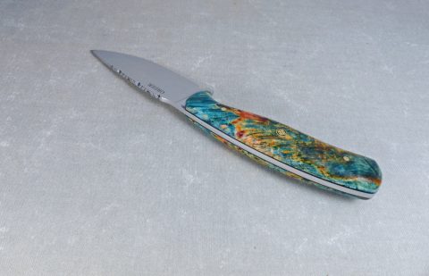 Top view of filework on colorful maple knife
